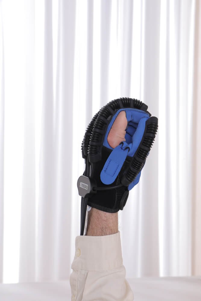 Power glove closing the patient's hand into a full fist