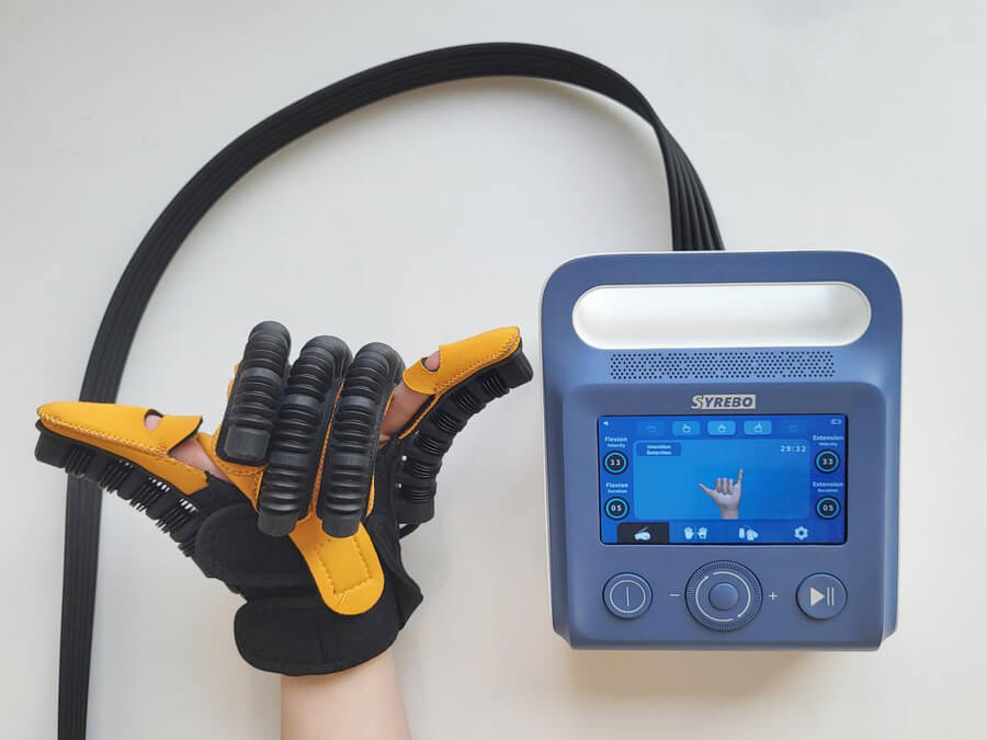 Syrebo C15 robotic glove connected to the control unit